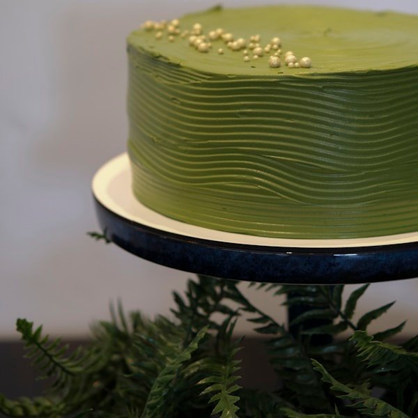 A green pistachio cake photographed from above