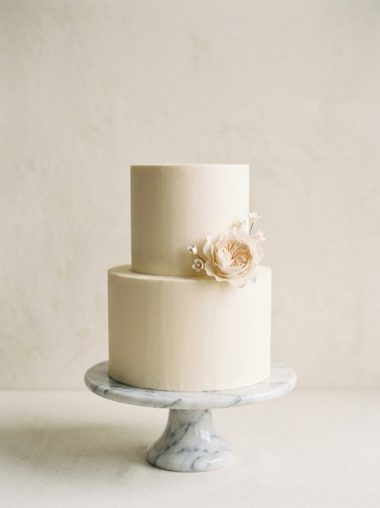 Pale cream celebration cake with a smooth finish